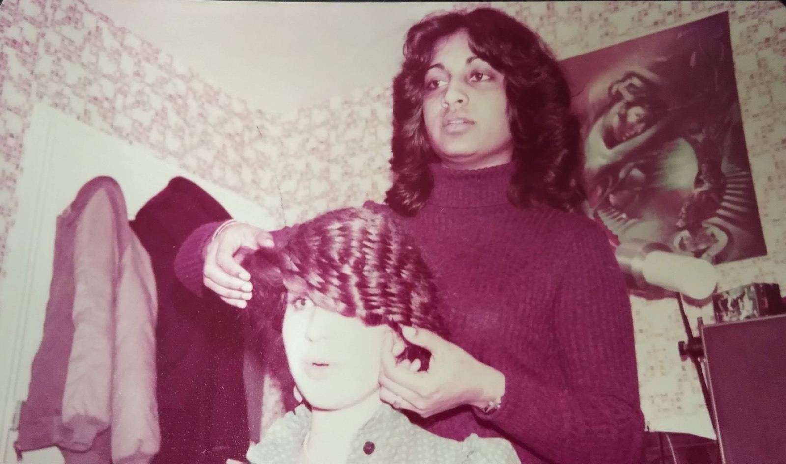 A young Nayana Karunaratne demonstrating a hairstyling technique